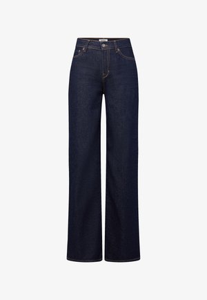 Donkerblauwe denim jeans met wijde pijpen, voorzien van een knoop- en ritssluiting, voorzakken en opvallende contrasterende stiksels.