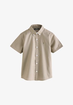 Chemise beige à manches courtes avec boutons, col et petit logo brodé sur le côté gauche de la poitrine.