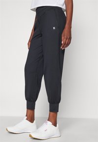 Sweaty Betty GAIA YOGA PANTS - Παντελόνι φόρμας - black