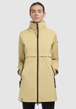 Yellow waterproof coat with a high collar, zippered front, side pockets, and adjustable cuffs. Features black zippers and subtle branding.
