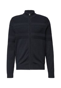 Suéter azul marino con cremallera, confeccionado en tela de punto con patrones de franjas texturizadas, cuello alto y puños ajustados. Textura suave con un corte holgado.