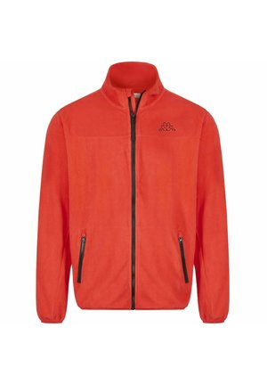 Giacca in pile arancione brillante con cerniera frontale nera a tutta lunghezza, tasche laterali con cerniera, polsini elasticizzati e piccolo logo nero sul petto a sinistra.
