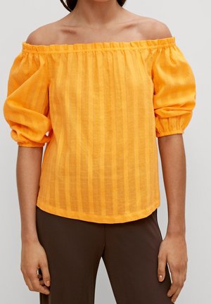 Blouse jaune à épaules dénudées avec manches bouffantes, présentant des rayures verticales et un tissu texturé. Matière douce et légère.