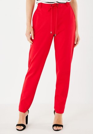 EVE PUNTA - Tracksuit bottoms - red