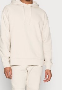 Fila Jersey con capucha - sand