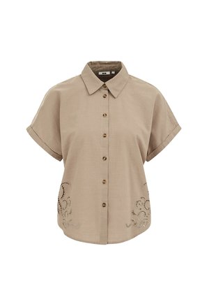 Chemise beige à manches courtes avec boutons, poignets retournés, col pointu et détails floraux brodés découpés près de l'ourlet de chaque côté.