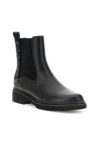 Stivale alla caviglia in pelle nera con pannello laterale elastico e piccoli borchiette decorative nere sulla parte posteriore del tallone, suola piatta e linguetta.