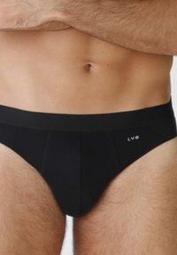 Slip neri da uomo realizzati in un tessuto morbido, con vita elastica e logo LVB. Presentano un design semplice, senza ulteriori motivi o dettagli.
