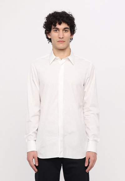 White long-sleeve button-up shirt made of smooth fabric, featuring a collar, front placket, and button cuffs. Simple, classic design.