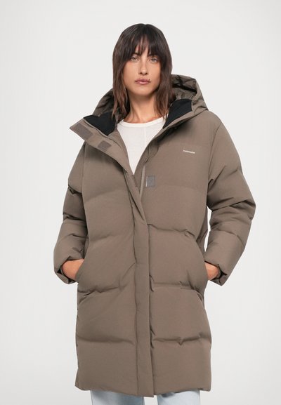 Brown padded winter coat with a hood, featuring a front zipper, two side pockets, and logo detail on the chest. Smooth outer texture.