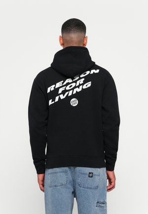 Sweatshirt preto com uma grande gráfica em texto branco nas costas, dizendo "RAZÃO PARA VIVER." Tem um bolso canguru e capuz ajustável.