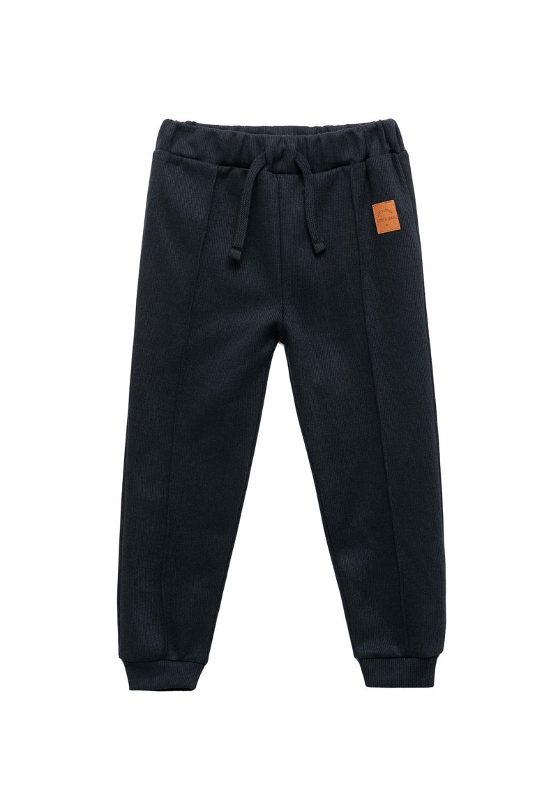 Pantalones de chándal negros de tejido suave, con una cinturilla elástica con cordón, puños acanalados y un pequeño parche de cuero marrón con el logo.