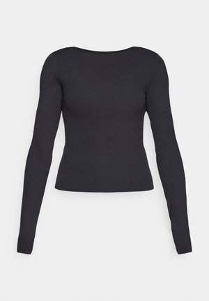 Musta pitkähihainen paita, jossa on tiukka muotoilu, pyöreä pääntie ja sileä rakenne. Ei näkyviä kuvioita tai metalliosia.