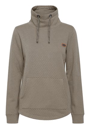 Felpa beige con colletto alto, lacci, motivo a pois e tasca frontale. Realizzata in tessuto morbido con polsini a coste.