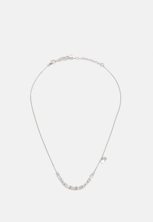 Silver chain necklace featuring rectangular and round clear gemstones with a polished finish, adjustable length, and a small tag accent.