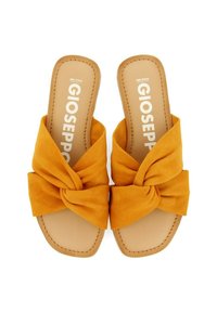 Sandali scivolati gialli in suede con un design a fiocco annodato, dotati di una suola piatta color tan e di un marchio impressa sulla soletta.