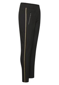 Pantalons noirs avec une taille élastique, dotés d'une poche zippée sur le côté et d'une bande dorée courant verticalement le long de la couture extérieure.