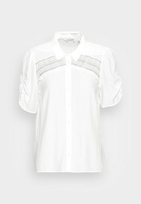 White short-sleeve blouse with a collar, featuring lace detailing across the chest and gathered puff sleeves. Button-down front design.