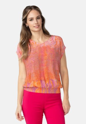 Short-sleeve top in a vibrant pink and orange pattern. Features a loose fit, round neckline, and gathered hem for a relaxed silhouette.