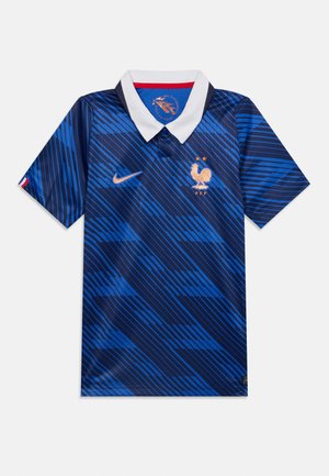 Maglia da calcio della Francia blu con strisce diagonali, colletto bianco, logo Nike ed emblema del gallo dorato con due stelle.