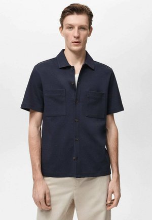 Navy short-sleeve shirt in lightweight fabric features two chest pockets and a button-down front. Simple collar design with a straight fit.