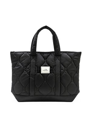 Sac cabas noir matelassé avec deux anses et une étiquette blanche à l'avant indiquant "VERTÈRE BERLIN,", présenté sur un fond blanc.