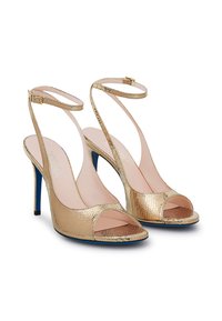 Sandali alti metallici dorati con design open toe, finitura testurizzata, cinturini alla caviglia e suole blu. Fibbia regolabile sui cinturini.