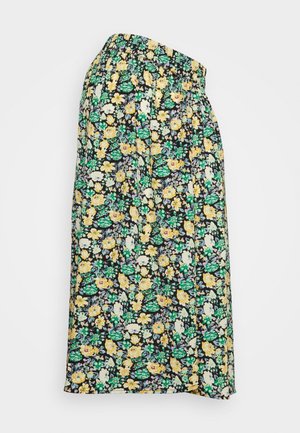 Jupe noire avec taille élastique ornée d'un imprimé floral jaune, blanc et vert, longueur genoux, en tissu léger.