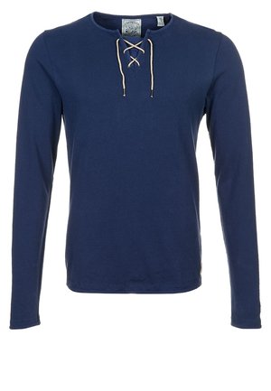 Maglia a maniche lunghe blu navy con scollo rotondo e dettaglio beige con lacci sullo scollo.