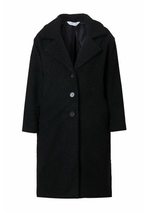 Manteau oversize noir en tissu texturé, doté d'un large col, de trois boutons et d'une coupe droite avec des poches latérales dissimulées.
