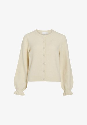 Lyse beige, strikket cardigan med rund hals, knaplukning og puffede ærmer. Har ribbede manchetter og kant med glat tekstur.