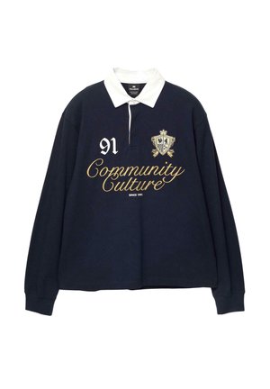 Polo a maniche lunghe blu marina con colletto bianco, caratterizzato da testo ricamato in oro "Community Culture" e numero "91", oltre a uno stemma decorativo.