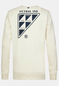 Cream-colored sweatshirt made of soft fabric, featuring a navy graphic design with geometric shapes and text on the back.