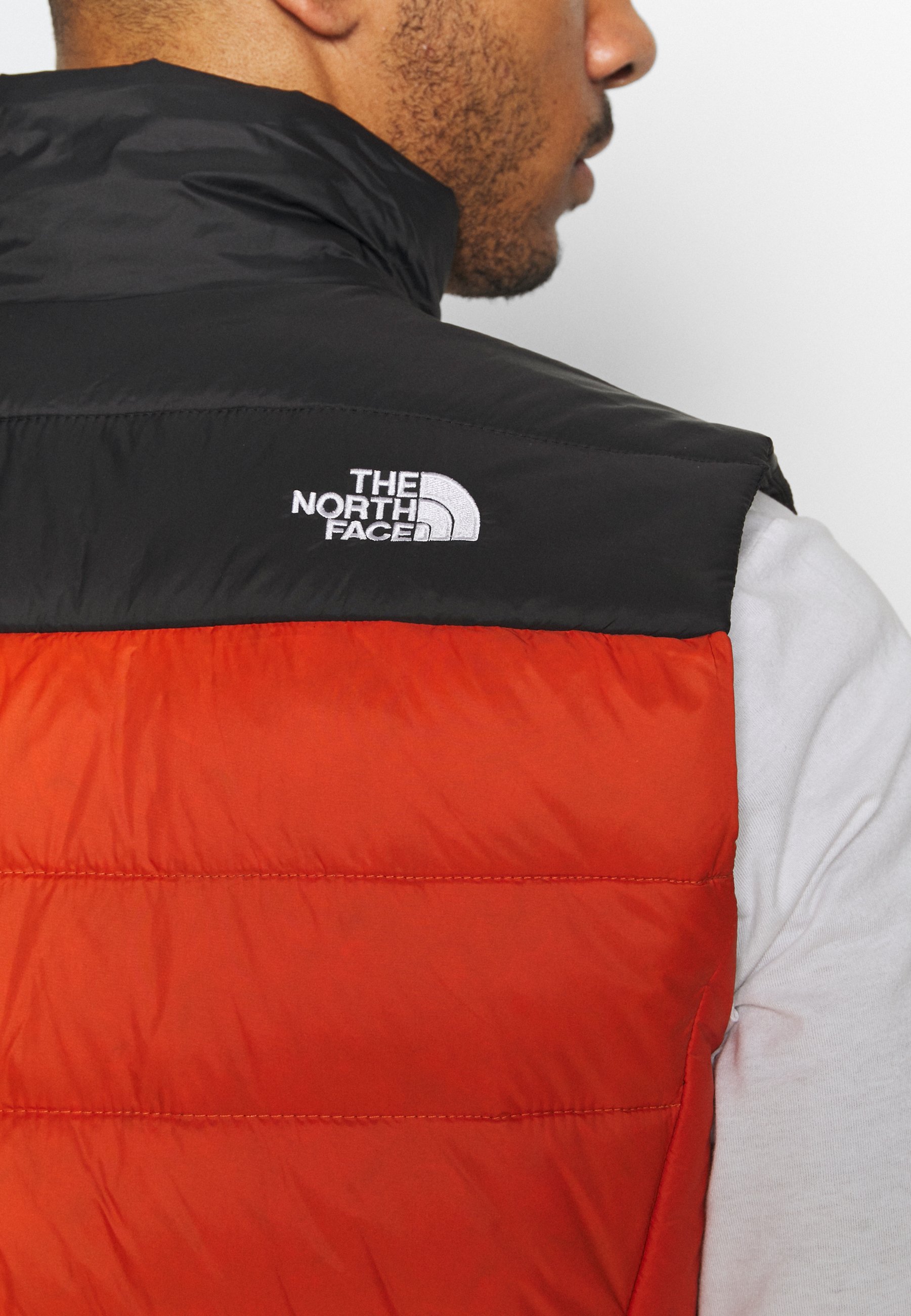 burnt orange north face jacket
