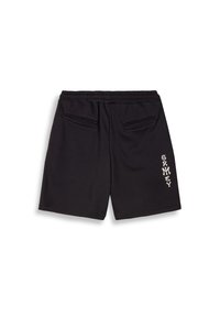Zwarte katoenen shorts met een elastische tailleband, twee achterzakken en witte tekst aan de linkerkant. Glad textuur en een ontspannen pasvorm.