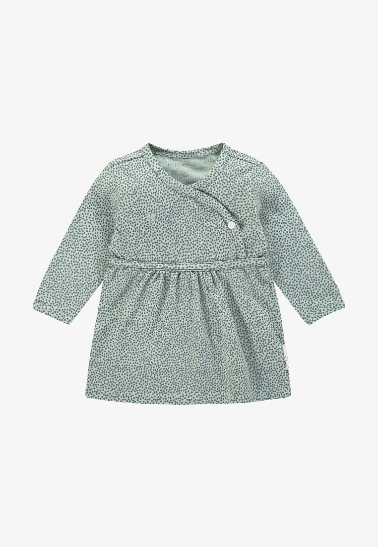 Robe bébé à manches longues avec fond vert clair et petit motif de points vert foncé, fermeture asymétrique avec pressions.