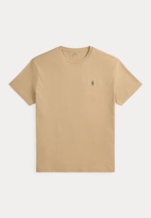 T-shirt beige manches courtes à col rond avec petit logo Polo Ralph Lauren brodé sur la poitrine gauche.