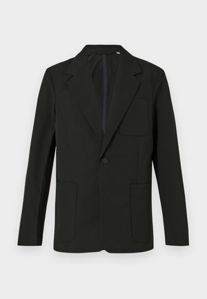 Must mustriga mustriga, ühe nupuga, kahe esikoti ja rinna taskuga. Valmistatud siledast kangast, millel on minimalistik disain.