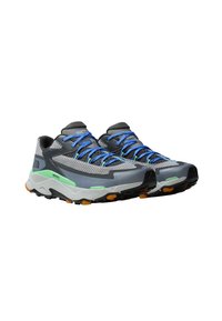 Gray athletic shoes with a mesh upper, blue laces, green accents, and orange outsole details, designed for trail running and outdoor activities.