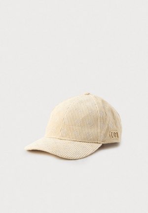 Beige kordfløjls-baseballkasket med subtile broderede mønstre og et lille guldfarvet "GG"-logo på siden.
