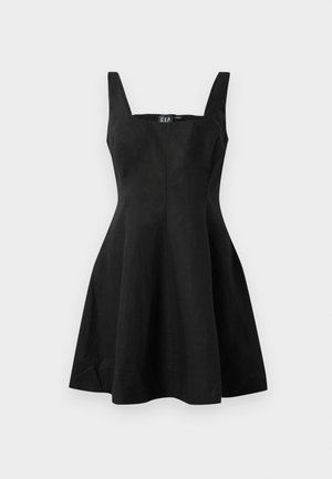 Svart ermeløs kjole med tettsittende overdel og utsvingt skjørt, laget av et glatt stoff. Kvadratisk halsutskjæring og minimale sømmer for et rent utseende.