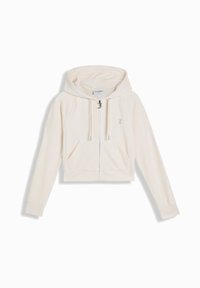 Hoodie cropped in beige chiaro con una texture morbida, chiusura anteriore con zip, due tasche frontali e cappuccio. Logo discreto sul petto.