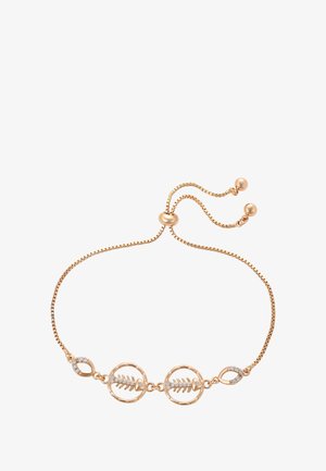 Verstelbare armband van roségoud met twee visgraatvormige bedels versierd met kleine heldere kristallen op een witte achtergrond.