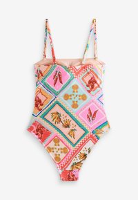 Vienos dalies maudymosi kostiumėlis su plonomis petnešėlėmis, margas ryškiomis kriauklių, bananų ir pipirų aplikacijomis ant rožinio fono.