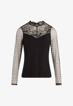 Haut noir avec un décolleté en dentelle et des manches longues semi-transparentes à pois. Le tissu est lisse avec un délicat détail en dentelle texturée.