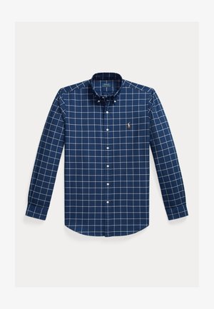 Navy blue button-up shirt made of cotton, featuring a white grid pattern, long sleeves, a button-down collar, and a small embroidered logo.