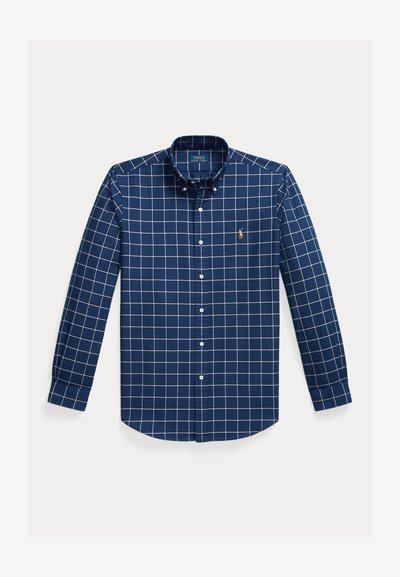 Navy blue button-up shirt made of cotton, featuring a white grid pattern, long sleeves, a button-down collar, and a small embroidered logo.