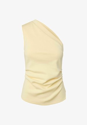 Kremfarget ermeløs topp med én skulderstropp og rysjedetaljer ved midjen, vist på hvit bakgrunn.