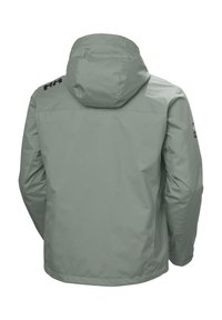 Lichtgroene waterdichte jas met een capuchon, voorzien van een gladde textuur, elastische manchetten en een logo op de bovenrug en mouw.