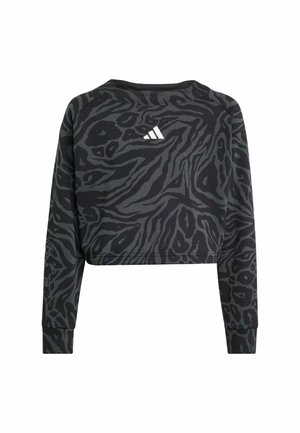 Sweatshirt court noir avec un motif animal en gris texturé. Il dispose de manches longues et d'un logo blanc au dos. Tissu doux.